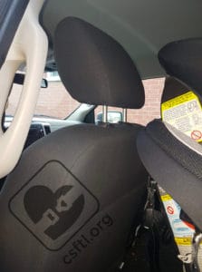 front seat upright showing room between the front seat and the rear facing graco convertible behind it