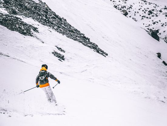 Skier moving through the snow in France