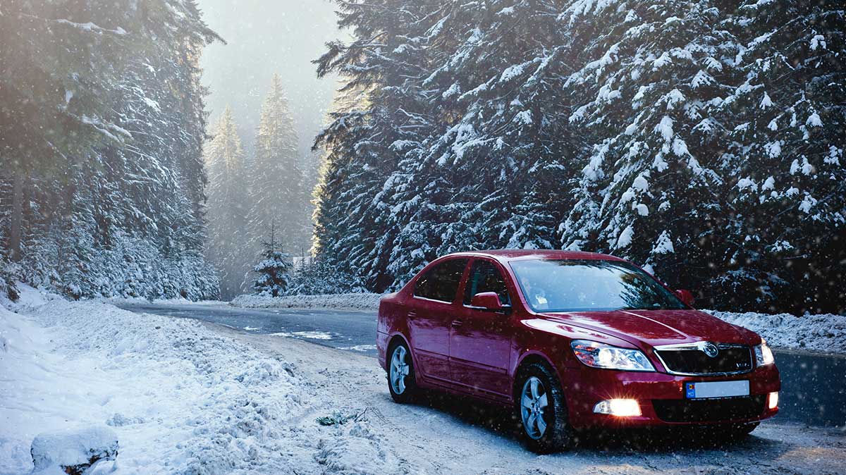 Red car driving in snow - do I need snow tires?