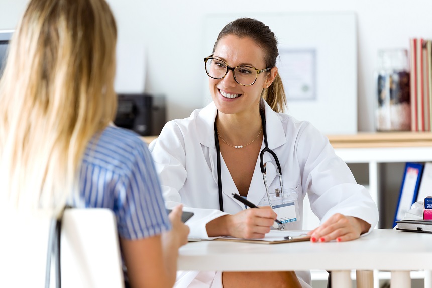 Female doctor explaining diagnosis to a woman. Female doctor explaining diagnosis to her patient.