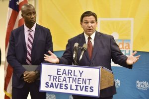 Florida Gov. Ron DeSantis, seen with Dr. Joseph Ladapo, Florida's surgeon general, addresses a question during a Jan. 4, 2022, Jacksonville news conference to discuss COVID-19 testing policy and monoclonal antibody treatment availability.