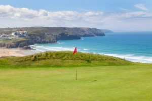 Golf course with view of the sea and beach below the cliff.