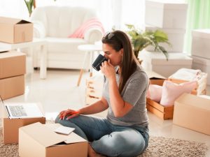 Young women taking a break during moving