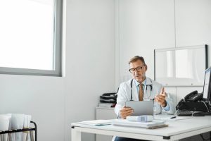 Doctor explaining through video call in clinic