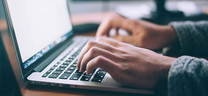 Image of person shopping online on a laptop