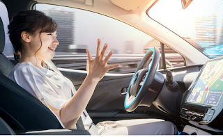 Woman hands off the steering wheel. Eyes on the road monitoring the vehicle