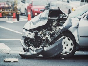 Auto accident damage at intersection.