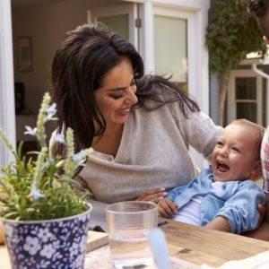 Family At Home Eating Outdoor Meal In Garden Together. Credit:Monkey Business Images/Shutterstock.com