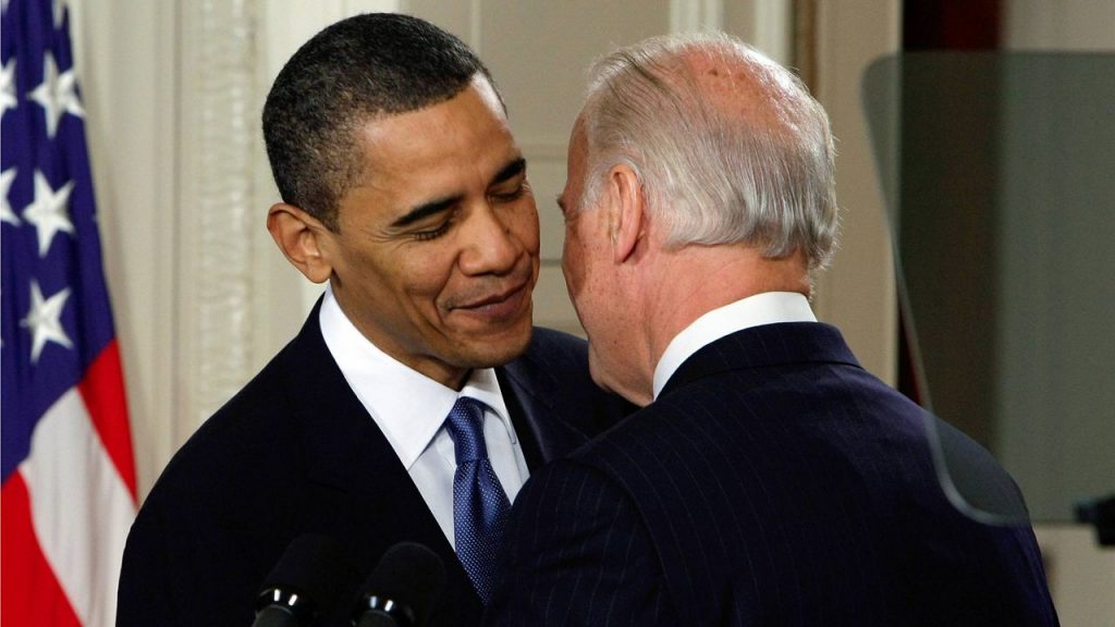 Vice President Joe Biden whispers "This is a big (expletive) deal," to President Barack Obama after introducing Obama during the health care bill ceremony in the East Room of the White House on March 23, 2010. (AP Photo/J. Scott Applewhite, File)