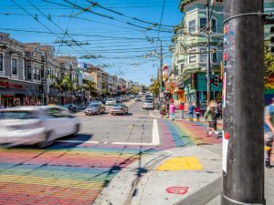 Rainbow crosswalk art at an intersection in San Francisco