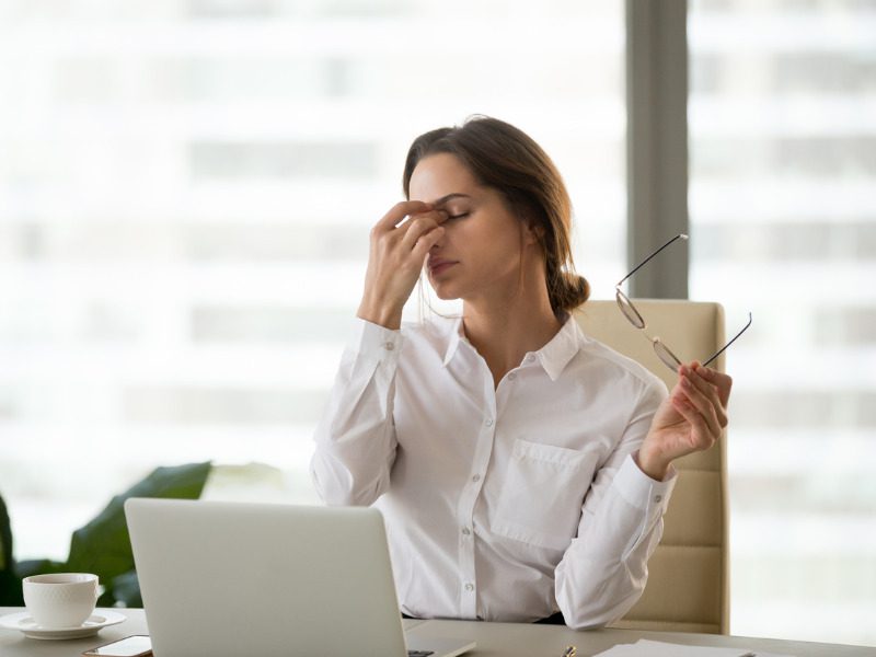 Fatigued worker in front of the computer