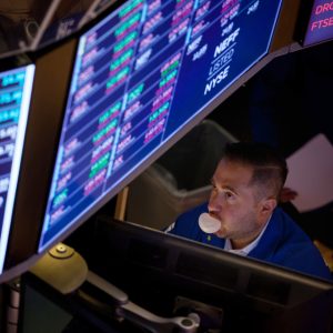 Stock trader blowing bubble with gum