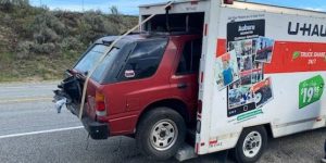 Cops Stop U-Haul Van with Isuzu Rodeo Hanging Out of Its Cargo Box