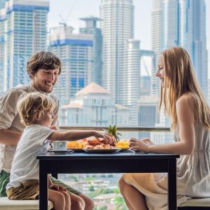 Family eating dinner on balcony