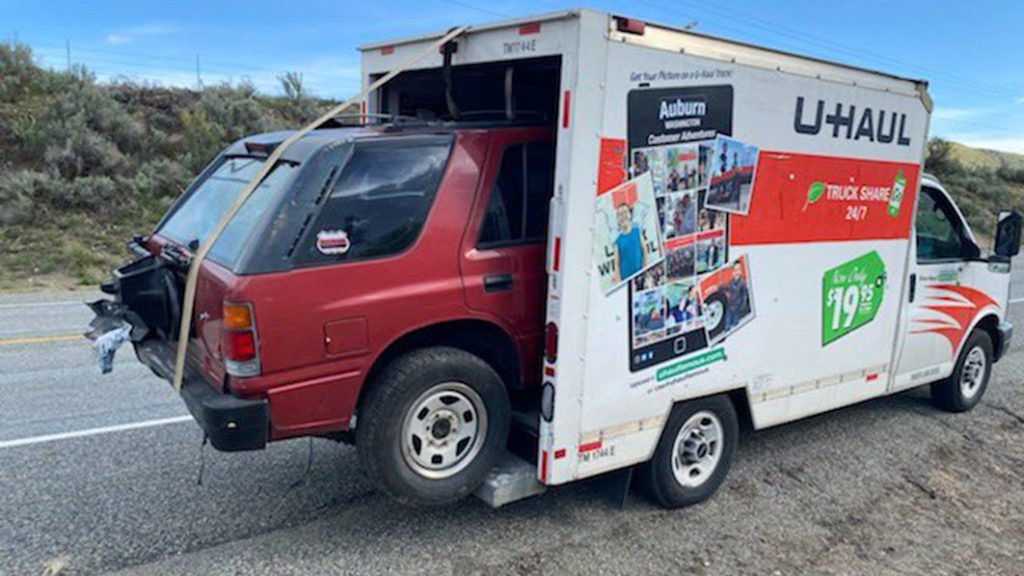 Someone loaded their Isuzu Rodeo in the back of a U-Haul van