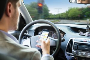 Use of hand-held devices while driving: Law change explained