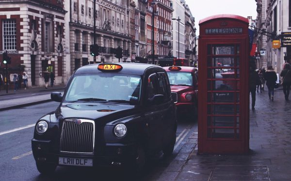 Black cab next to iconic red telephone box