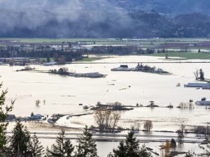 Flood and black smoke from a fire in Abbotsford