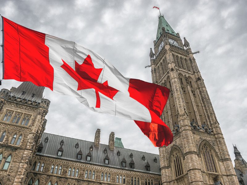 Canadian flag in front of parliament in Ottawa