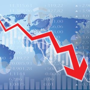 stock image of red arrow dropping over a map of globe and declining stock prices