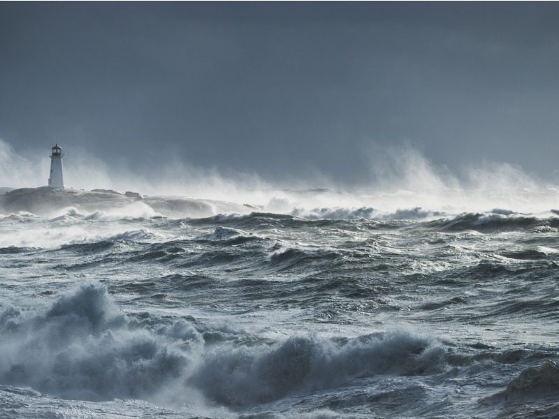 Giant waves break near the lighthouse at Peggy's Cove, Nova Scotia.