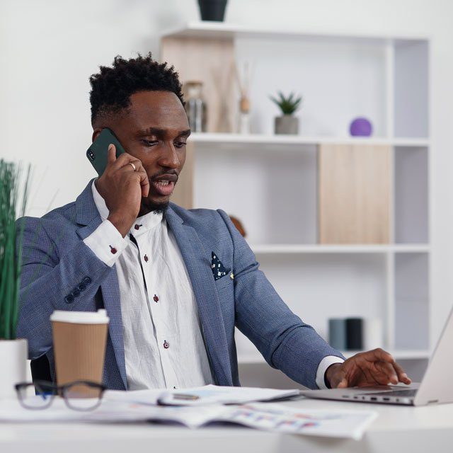 Businessman on phone and laptop