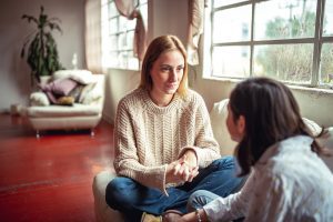 Mother and teen have a talk at home