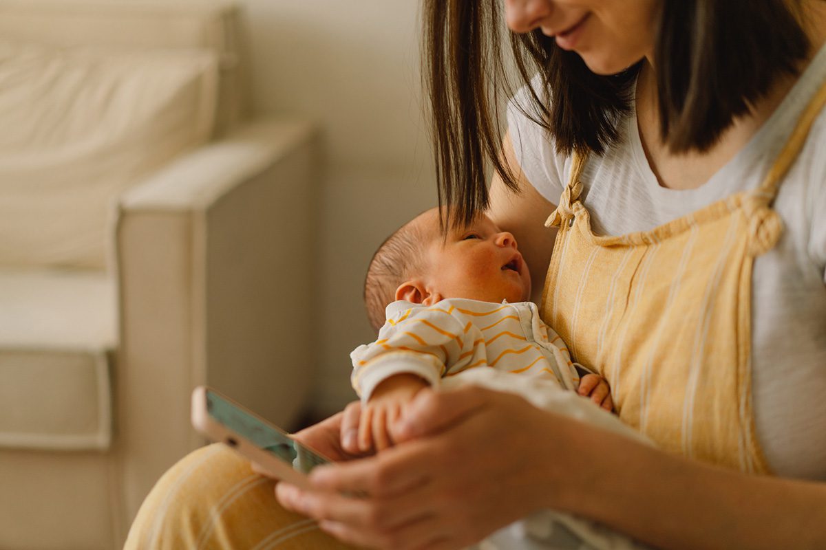 A mother calls a Register Nurse Health Coach while her baby naps