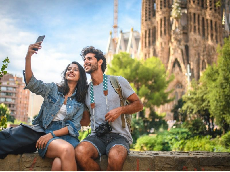 Young people taking a travel selfie.