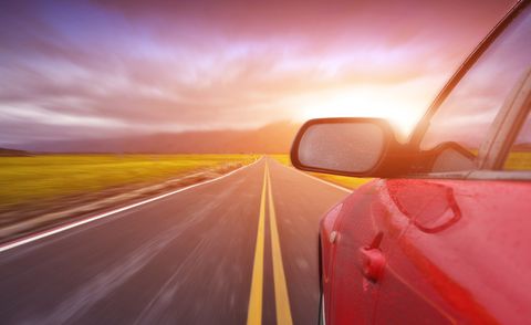 driving on the highway at sunset