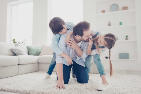 single dad playing with children