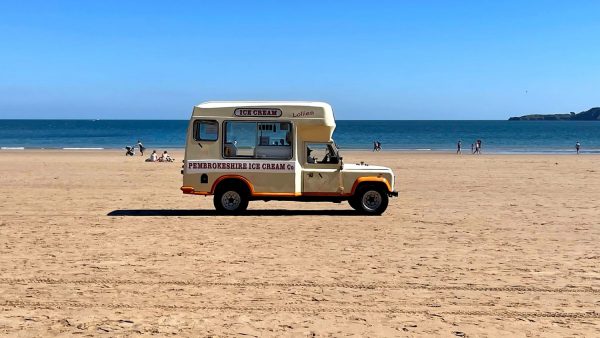 Land Rover converted to a cool looking ice cream van on the beach