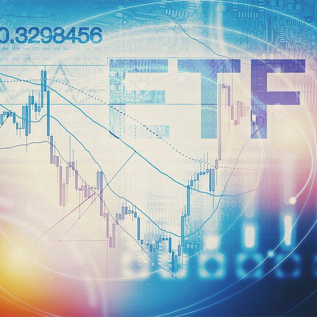 Blue and white image of a stock chart with he letters ETF in the upper right corner and a yellow globe in he lower left corner