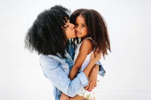 mom embracing daughter