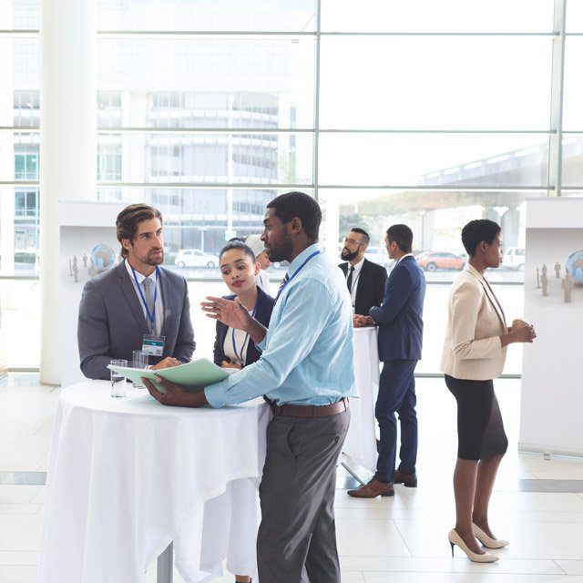 People networking at a conference