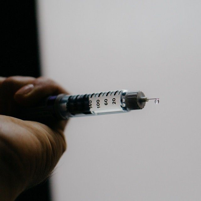 A person tests the flow of a Sanofi Lantus brand SoloStar insulin pen in an arranged photograph taken in the Brooklyn borough of New York, U.S., on Friday, April 5, 2019. Makers of top-selling insulin products will continue to bear the brunt of Congress