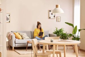 Serious female freelancer using tablet at home