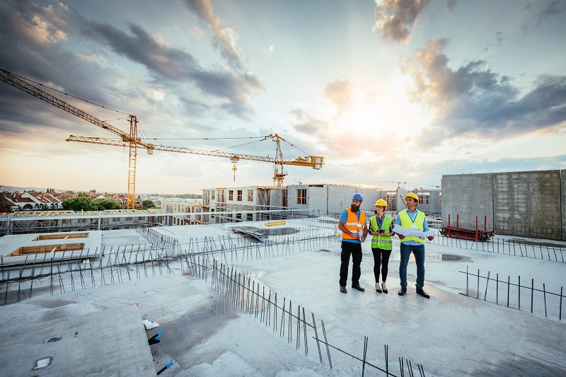 Employees working on construction site,