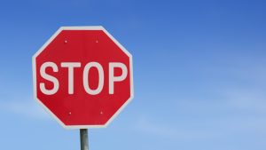 Tesla FSD tricked into stopping early by oversized stop signs