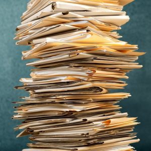 Stack of manila folders filled with documents