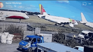 Watch This Anxiety-Inducing Video of a Small Plane Flying Between Two Jets In a Crash Landing