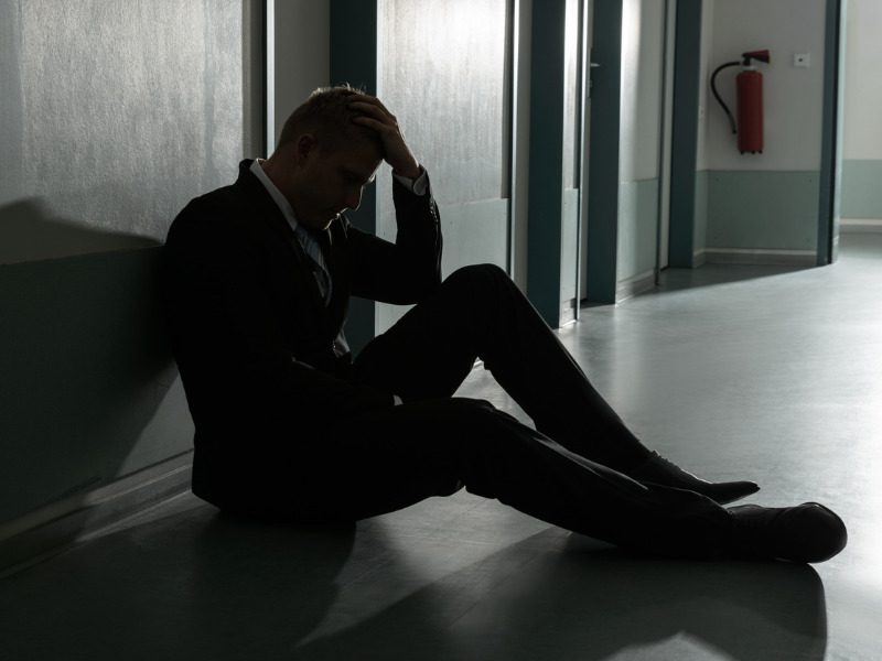 Unhappy businessman in his office