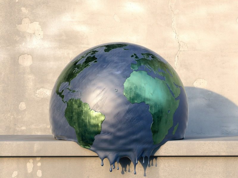 Model of a melting globe sitting on a shelf