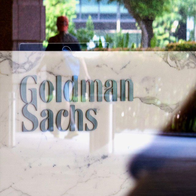 image of Goldman Sachs building with its logo in blue letters