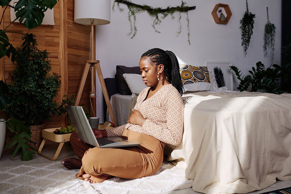 Woman using laptop at home