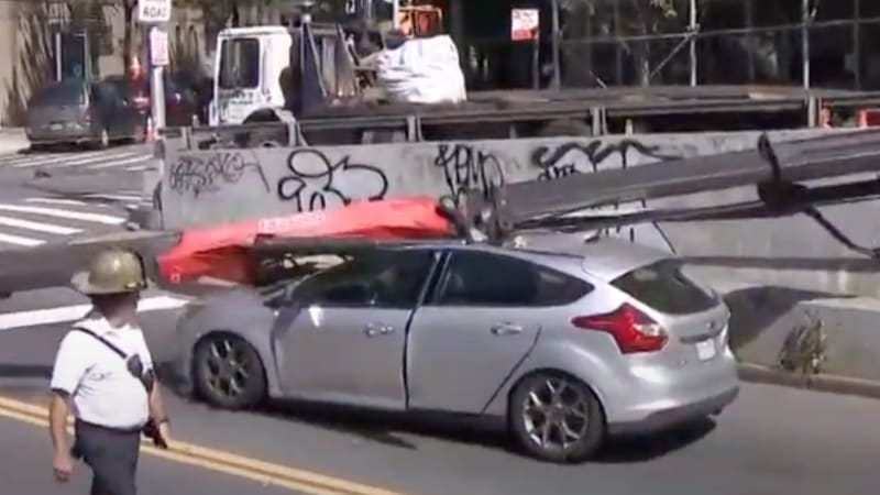 NYC driver escapes with minor injuries as crane crushes car