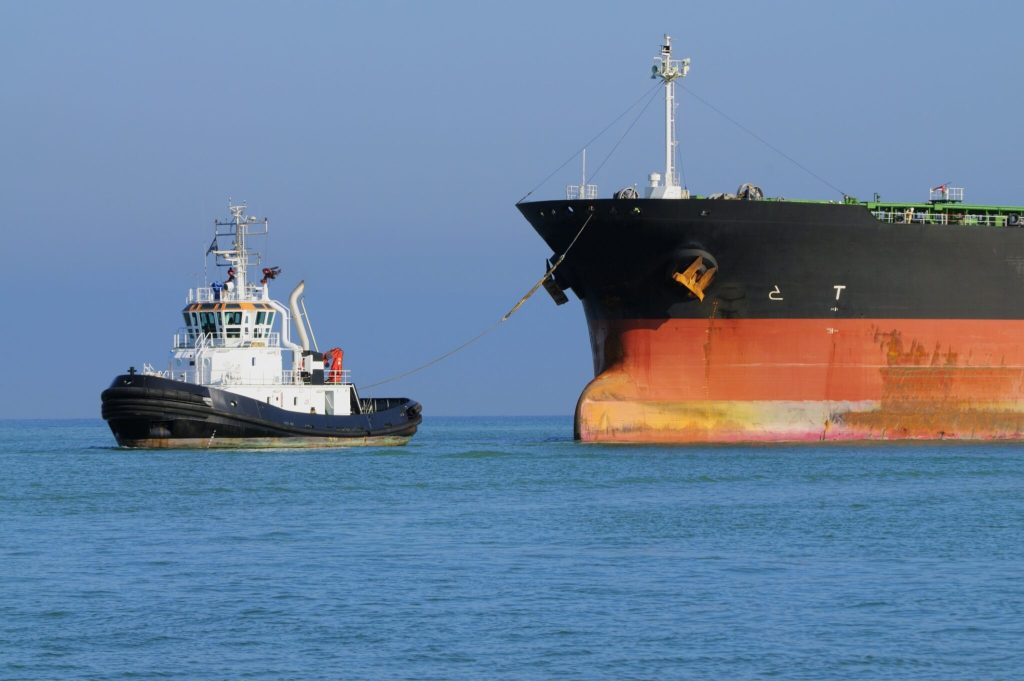 Industrial ship and tugboat