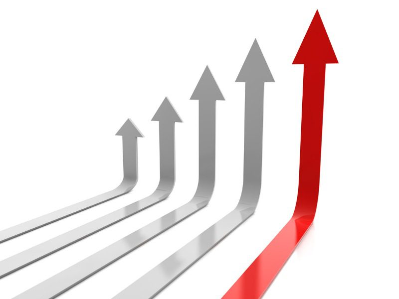 Five upward pointing arrows, increasing in size. The tallest one is red and the shorter ones are grey