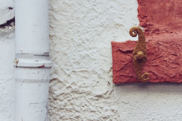 Pipe on side of house