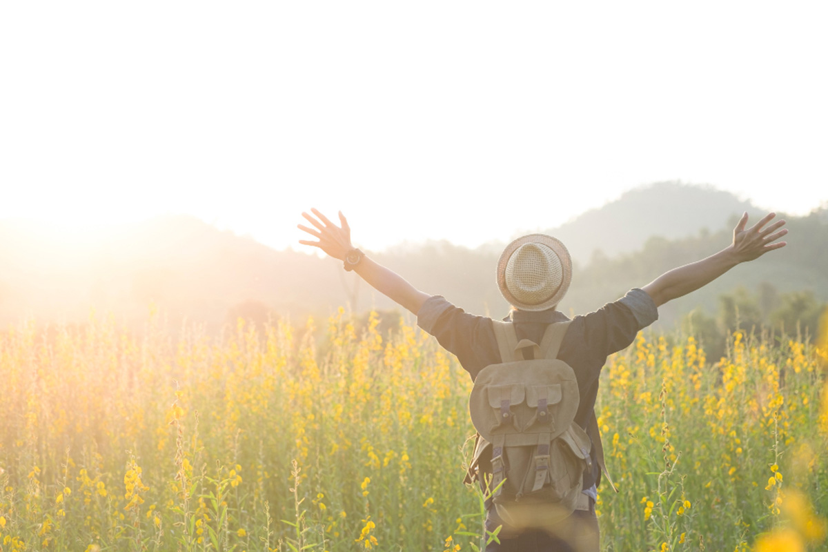 Happy man in a field of flowers